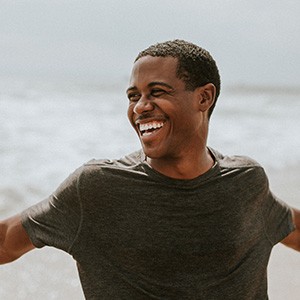 Closeup of man smiling at beach