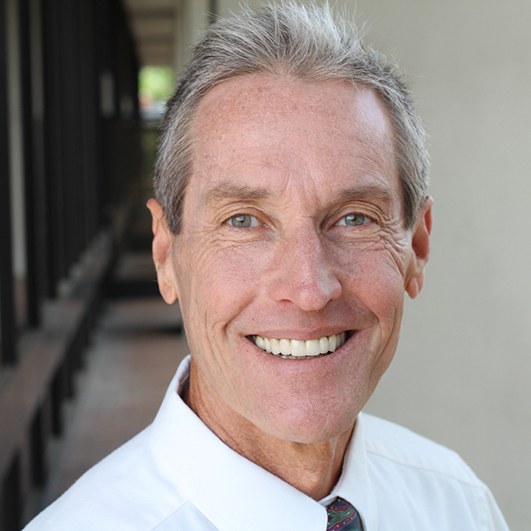 Man smiling outside