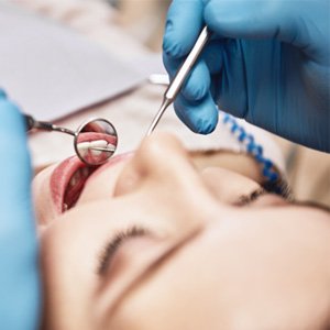 Woman undergoing dental exam