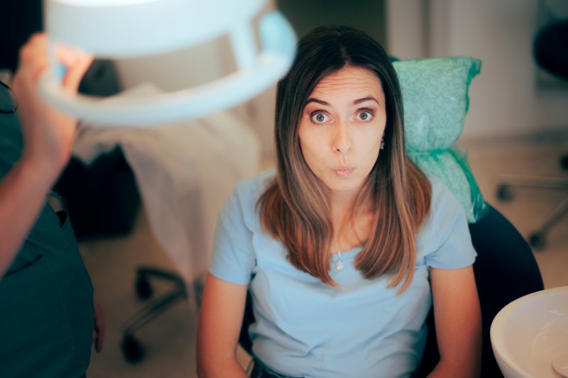 Patient looking anxious after discount dental implants
