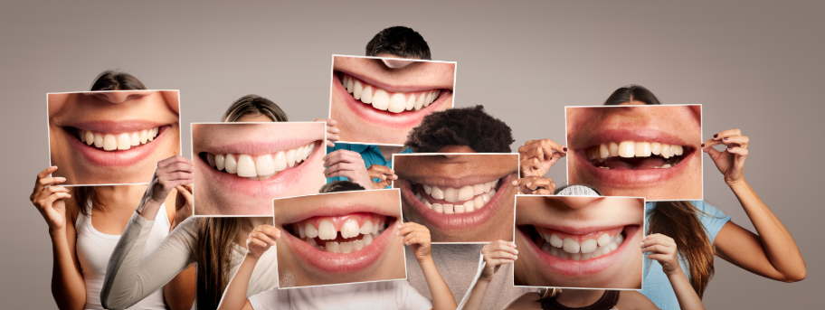 Group photo of people holding pictures of smiles over their faces